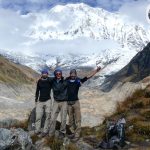 Adventurers conquering Mount Annapurna's majestic heights, surrounded by breathtaking Himalayan landscapes on a thrilling expedition.