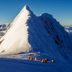 Brave climbers conquer Manaslu, the eighth highest peak. Breathtaking views, challenging ascent, triumphant achievement.