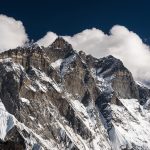 Mountaineers ascending steep slopes amidst icy peaks on the Lhotse Middle expedition, embracing the beauty and challenges of the world's fourth highest mountain.