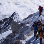Adventurous climbers conquer Kanchenjunga, the third highest peak. Majestic views, challenging terrain, triumphant teamwork.